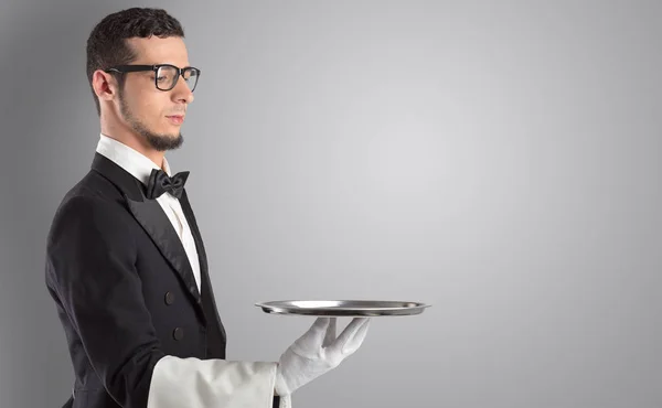 Waiter serving with white gloves and steel tray — Stock Photo, Image