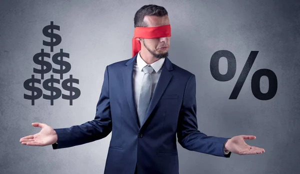 Man with ribbon on his eye holding dollar signs — Stock Photo, Image