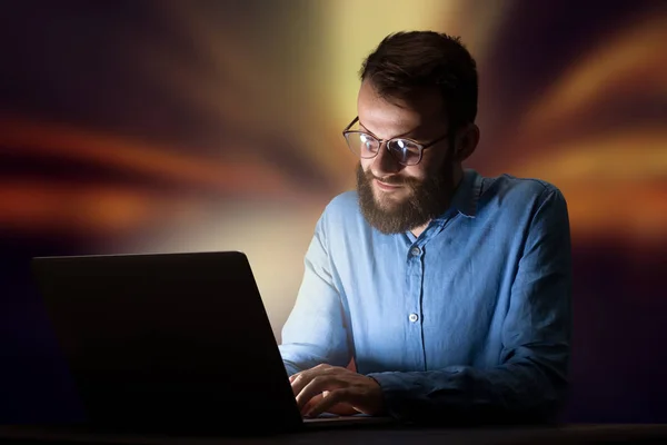 Businessman in the office at night