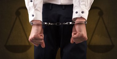 Arrested man with balance on the background clipart