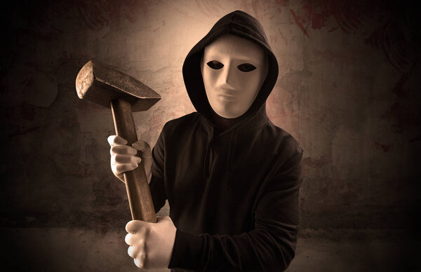 Armed assassin in an empty bloody room concept