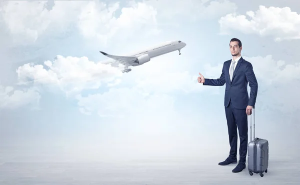 Agent hitchhiking with departing plane concept — Stock Photo, Image