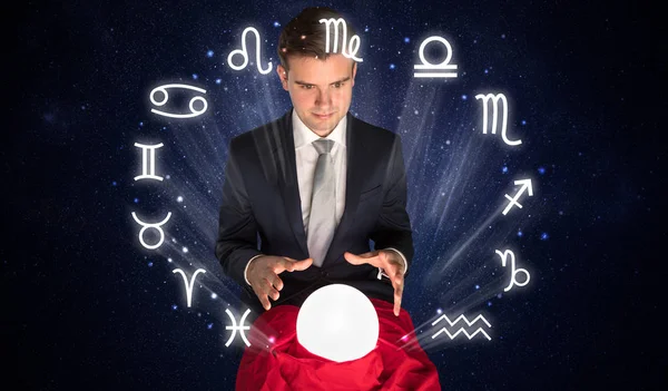 Astronaut looking for inspiration in his crystal magic ball — Stock Photo, Image