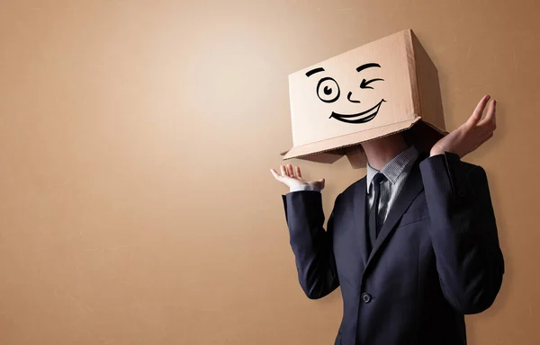 Young man  with happy cardboard box face — Stock Photo, Image