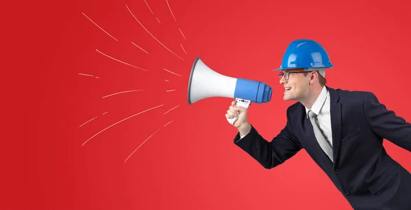 Young architect yelling with megaphone — Stock Photo, Image