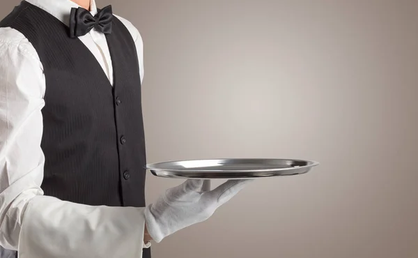 Waiter serving with white gloves and steel tray — Stock Photo, Image