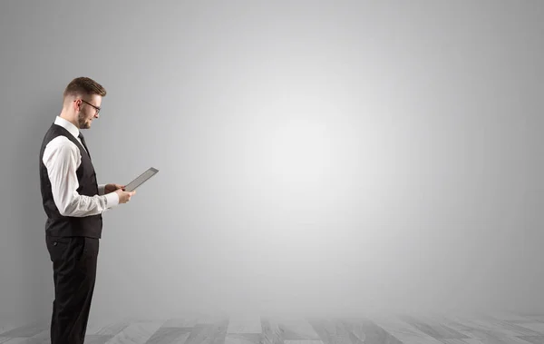 Businessman standing in an empty space — Stock Photo, Image