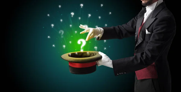 Magician conjure question signs from a cylinder — Stock Photo, Image
