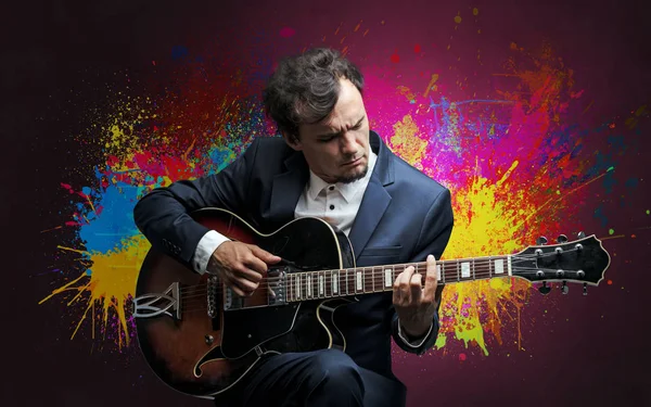 Composer with splotch and his guitar Stock Photo