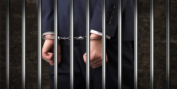 Close handcuffed man in jail — Stock Photo, Image