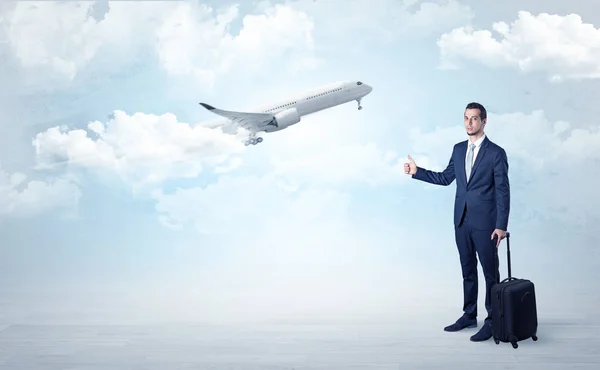 Agent hitchhiking with departing plane concept — Stock Photo, Image