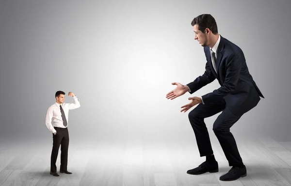 Giant businessman scared of small businessman — Stock Photo, Image