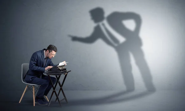 Man working hard and shadow arguing with him — Stock Photo, Image