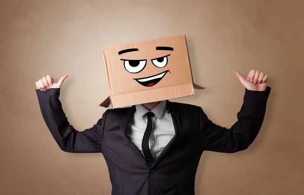 Young man  with cardboard box on his head — Stock Photo, Image