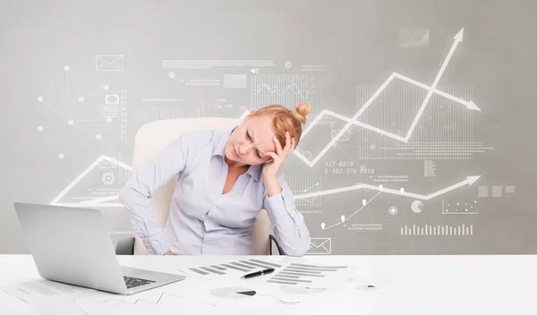 Business person sitting at desk with financial change concept — Stock Photo, Image