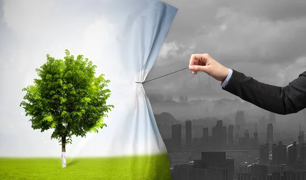 Hand pulling nature cityscape curtain to gray cityscape — Stock Photo, Image
