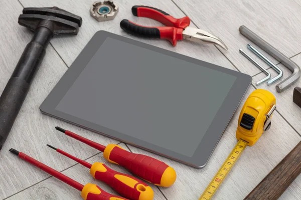 Household tools and tablet with empty screen — Stock Photo, Image