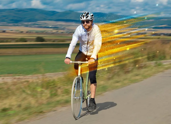 Young riding bicycle in nature — Stock Photo, Image