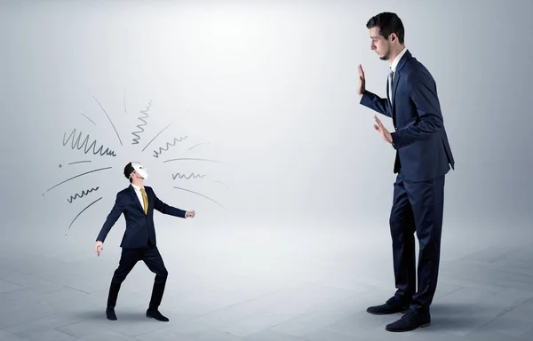 Conflict between small and big businessman — Stock Photo, Image