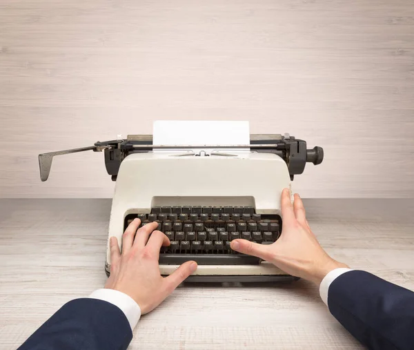 First person perspectve hand writing on an oldschool typewriter