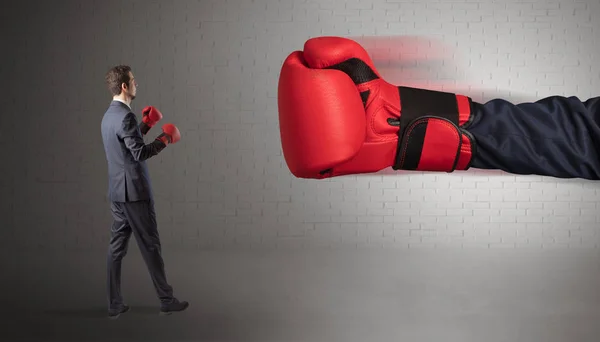 Businessman fighting with boxing gloves