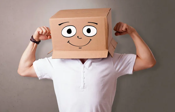 Young boy with happy cardboard box face — Stock Photo, Image