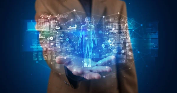 Młoda osoba trzyma hologram projekcji z pojęciem zdrowia — Zdjęcie stockowe