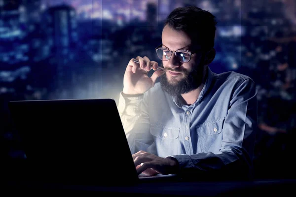 Businessman in the office at night — Stock Photo, Image