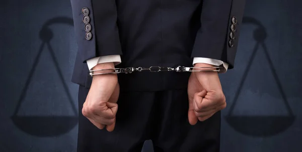 Arrested man with balance on the background — Stock Photo, Image
