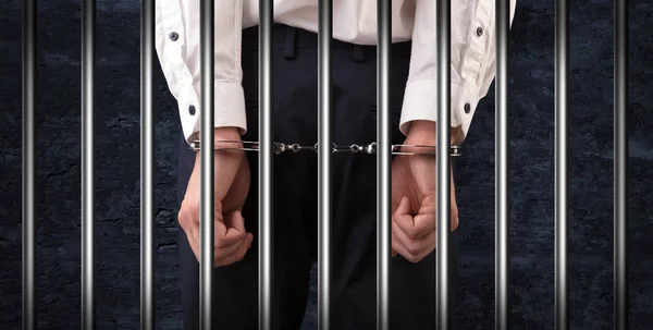 Close handcuffed man in jail — Stock Photo, Image