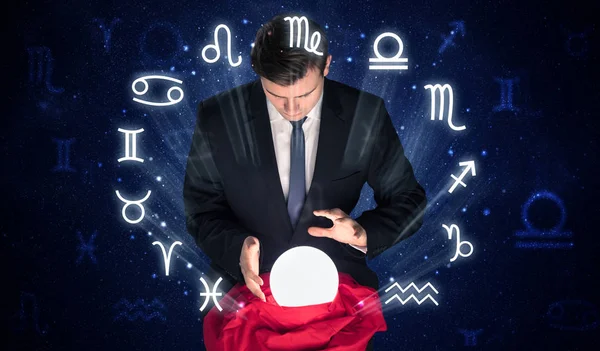 Astronaut looking for inspiration in his crystal magic ball — Stock Photo, Image