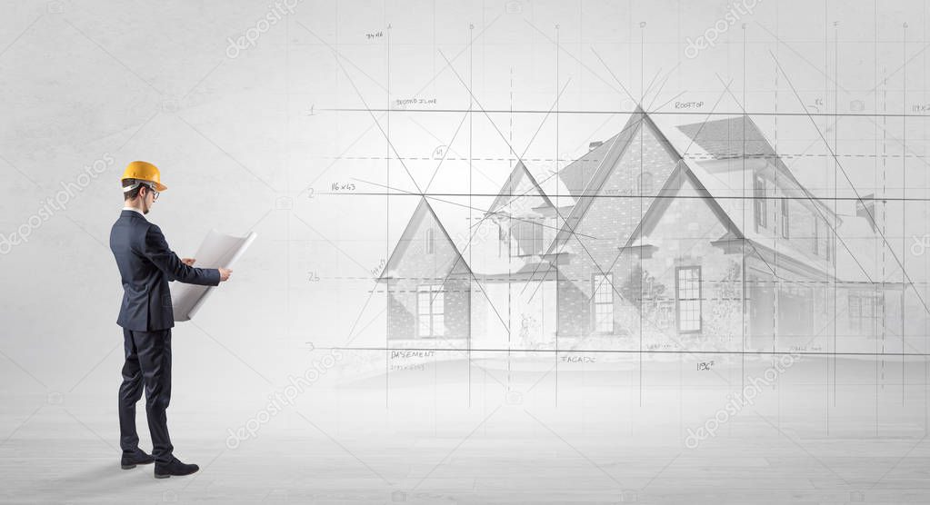 Architect standing with house plan