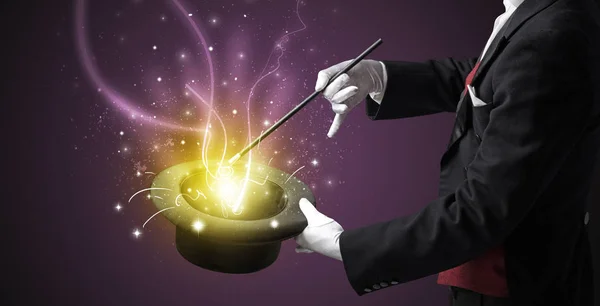 Magician hand conjure miracle from cylinder — Stock Photo, Image