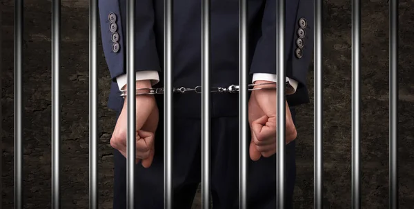 Close handcuffed man in jail — Stock Photo, Image