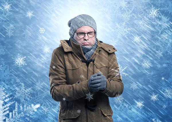 Boy freezing in warm clothing and snowing concept — Stock Photo, Image