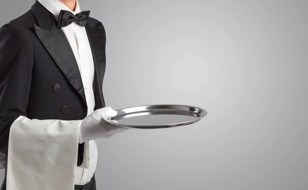 Waiter serving with white gloves and steel tray — Stock Photo, Image