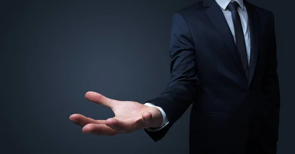 Businessman handing something without concept — Stock Photo, Image