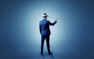 Businessman in an empty room with vr glasses clipart
