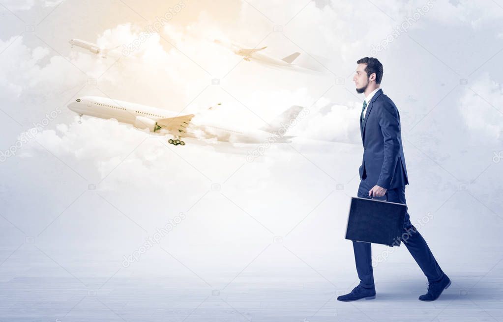 Businessman going somewhere with airplane