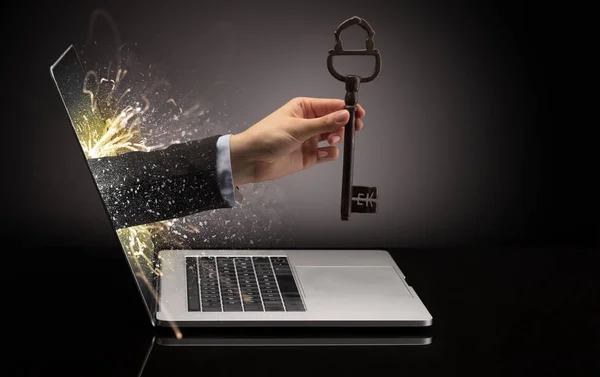 stock image Hand with key coming out of a laptop