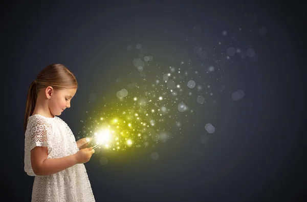 Little kid playing on sparkling tablet — Stock Photo, Image