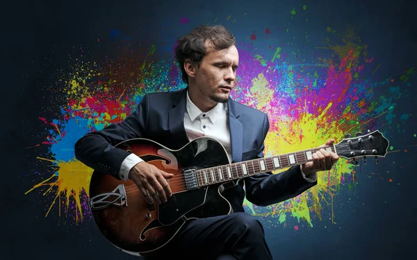 Composer with splotch and his guitar — Stock Photo, Image