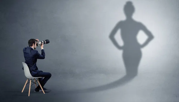 Businessman staying and offering stuffs to a shadow woman — Stock Photo, Image