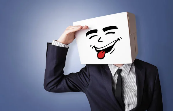 Young boy with happy cardboard box face — Stock Photo, Image