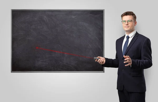 Handsome man teaching in classroom — Stock Photo, Image