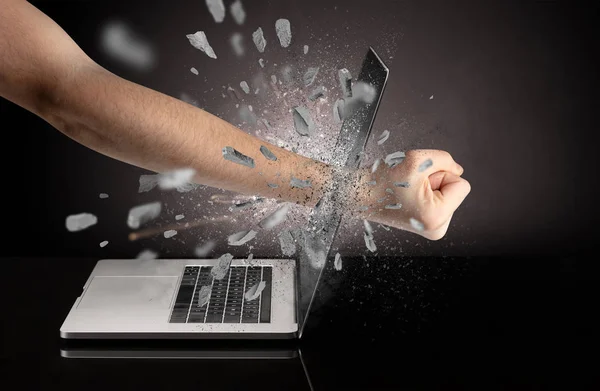 Hand breaks laptop screen