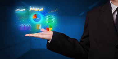 Diyagramları elinde tutan el