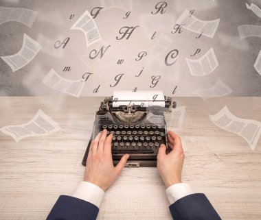 Hand typewriting with flying documents around clipart