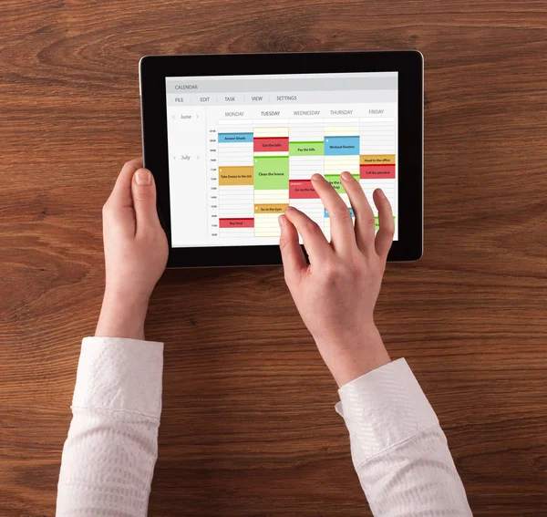 Hand holding tablet with timetable concept — Stock Photo, Image