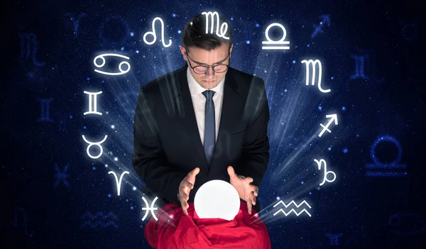 Astronaut looking for inspiration in his crystal magic ball — Stock Photo, Image
